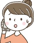 困って電話をしている女性